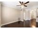 Bright living room featuring hardwood floors, neutral paint, and a stylish ceiling fan at 7009 E Acoma, Lot 2134 Dr # 2134, Scottsdale, AZ 85254