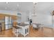 Open kitchen design with an island, stainless steel appliances, a dining table, and light wood cabinetry at 842 W Saragosa St, Chandler, AZ 85225