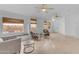 Inviting living room with tile floors, three windows providing natural light, and comfortable seating at 842 W Saragosa St, Chandler, AZ 85225