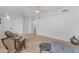 Open living room featuring tile floors, ceiling fans, ample space, and cozy seating areas at 842 W Saragosa St, Chandler, AZ 85225
