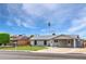 Charming single-story home with a covered parking area and well-maintained front yard at 9716 N 55Th Ave, Glendale, AZ 85302