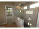 Modern bathroom with a glass enclosed shower and contemporary finishes at 1956 W Rowel Rd, Phoenix, AZ 85085