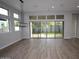 Light-filled living room with large sliding glass doors, offering seamless indoor-outdoor living at 1956 W Rowel Rd, Phoenix, AZ 85085