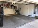 Spacious two-car garage with ample storage and a utility sink at 2638 W Sat Nam Way, Phoenix, AZ 85086