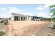 Backyard view of a single-Gathering home with landscaping potential and an existing covered patio at 26995 W Adam Ave, Buckeye, AZ 85396
