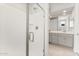 Bathroom featuring a glass shower and dual sink vanity with modern fixtures at 26995 W Adam Ave, Buckeye, AZ 85396