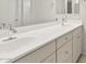 Bathroom featuring a dual sink vanity and a large mirror at 6247 W Georgetown Way, Florence, AZ 85132