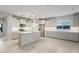 Spacious kitchen with stainless steel appliances, an island with breakfast bar, and ample counter space at 6247 W Georgetown Way, Florence, AZ 85132