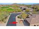 Expansive aerial view of a home near a golf course with mountain views at 6827 E Eagle Feather Rd, Scottsdale, AZ 85266