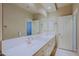 Bathroom features double sinks with a large mirror and plenty of cabinet space at 6827 E Eagle Feather Rd, Scottsdale, AZ 85266