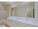 Bathroom features a soaking tub and shower with double sinks and a large mirror at 6827 E Eagle Feather Rd, Scottsdale, AZ 85266