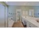 Elegant bathroom features a frosted glass shower, soaking tub, and dual vanity at 6827 E Eagle Feather Rd, Scottsdale, AZ 85266