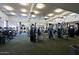 Spacious gym featuring modern equipment, ample natural light, and a clean, motivating workout environment at 6827 E Eagle Feather Rd, Scottsdale, AZ 85266