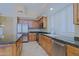 Kitchen with stainless steel appliances, granite countertops and tile flooring at 6827 E Eagle Feather Rd, Scottsdale, AZ 85266