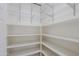 Walk-in pantry with wire shelving for ample storage space at 6827 E Eagle Feather Rd, Scottsdale, AZ 85266