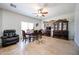 Elegant dining room with a large table, stone wall accent, and decorative hutch for formal gatherings at 10037 W Chipman Rd, Tolleson, AZ 85353