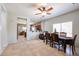 Inviting dining space with natural light, an elegant table setting, and easy access to the kitchen at 10037 W Chipman Rd, Tolleson, AZ 85353