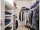 Walk-in closet with custom shelving and plenty of room for storage at 10037 W Chipman Rd, Tolleson, AZ 85353