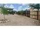 Spacious backyard featuring a pergola and privacy fence at 10241 E La Palma Ave, Gold Canyon, AZ 85118