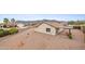 Expansive backyard with desert landscaping, a covered patio, and mountain views at 10241 E La Palma Ave, Gold Canyon, AZ 85118