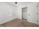 Cozy bedroom with neutral carpet, closet, and ample natural light at 10241 E La Palma Ave, Gold Canyon, AZ 85118