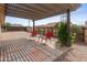 Covered patio featuring outdoor seating, perfect for relaxing or entertaining guests at 10241 E La Palma Ave, Gold Canyon, AZ 85118