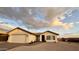 Cozy single-story home featuring a two-car garage, low-maintenance landscaping, and charming curb appeal at 10241 E La Palma Ave, Gold Canyon, AZ 85118