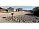 Charming single-story home with low maintenance desert landscaping, and a two-car garage at 10241 E La Palma Ave, Gold Canyon, AZ 85118