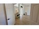 A hallway scene with modern flooring and an elegant side table with view to the outdoor space at 10241 E La Palma Ave, Gold Canyon, AZ 85118