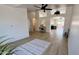 Bright open-concept living space with modern flooring, arched doorways, and a view into the kitchen at 10241 E La Palma Ave, Gold Canyon, AZ 85118