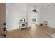 Bright living room featuring wood floors, arched doorways, and stylish decor at 10241 E La Palma Ave, Gold Canyon, AZ 85118