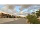 Scenic street showcasing Southwestern architecture against a backdrop of mountains and stunning skies at 10241 E La Palma Ave, Gold Canyon, AZ 85118