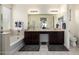 Luxurious bathroom with double vanity, soaking tub, separate shower, and elegant fixtures at 10454 W Maya Way, Peoria, AZ 85383