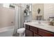 Well-lit bathroom featuring a shower-tub combo, decorative shelves, and contemporary fixtures at 10454 W Maya Way, Peoria, AZ 85383