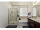Well-lit bathroom with soaking tub, walk-in shower, and double vanity at 10454 W Maya Way, Peoria, AZ 85383