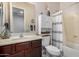 Clean bathroom boasting a sink vanity, wall mirror, and a shower-tub combination for optimal functionality at 10454 W Maya Way, Peoria, AZ 85383