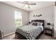Cozy bedroom with carpet, ceiling fan, and natural light from a window, creating a relaxing atmosphere at 10454 W Maya Way, Peoria, AZ 85383