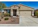 Charming single-story home featuring a tile roof and low-maintenance desert landscaping at 10454 W Maya Way, Peoria, AZ 85383