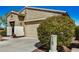 Attractive single-story home featuring a neutral-colored exterior and manicured landscaping at 10454 W Maya Way, Peoria, AZ 85383