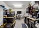 Organized garage with storage bins, workbenches, and tool cabinets, maximizing space for hobbies and projects at 10454 W Maya Way, Peoria, AZ 85383