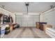 Clean garage with epoxy flooring and storage solutions, offering ample space for vehicles and projects at 10454 W Maya Way, Peoria, AZ 85383