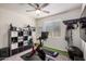 Home gym with exercise bike, treadmill, storage shelves, and carpeted floor for a dedicated workout space at 10454 W Maya Way, Peoria, AZ 85383