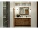 Elegant bathroom featuring a wood framed mirror, decorative tile, and custom vanity at 10596 E Yearling Dr, Scottsdale, AZ 85255