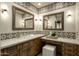 Well-appointed bathroom with dual sinks, framed mirrors, and custom cabinetry at 10596 E Yearling Dr, Scottsdale, AZ 85255