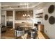 Stylish dining room featuring modern decor, warm wood tones, and a chic chandelier at 10596 E Yearling Dr, Scottsdale, AZ 85255