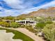 Beautiful desert home overlooking the golf course and adjacent to the mountain with gorgeous native landscaping at 10596 E Yearling Dr, Scottsdale, AZ 85255