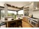 Well-appointed kitchen with island seating, stainless steel appliances, and a large window framing desert views at 10596 E Yearling Dr, Scottsdale, AZ 85255