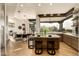 Open-concept kitchen with wooden cabinets, an island, stainless steel appliances, and a scenic view at 10596 E Yearling Dr, Scottsdale, AZ 85255