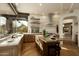 Beautiful kitchen with a wooden cabinets, center island, stainless steel appliances and scenic views at 10596 E Yearling Dr, Scottsdale, AZ 85255