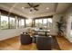 Bright home office with wood floors, beamed window trim, ceiling fan, and mountain views at 10596 E Yearling Dr, Scottsdale, AZ 85255